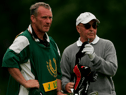 Joe Lewis (right) has been charged with insider trading by a US District Attorney (Credit: Getty)