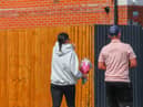 Members of the community lay flowers at the scene of the crash on Turnstone Road, Walsall.
