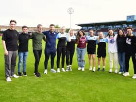 Jade Thirlwall with representatives of the SSFC women’s team, office team and Stonewall. Photo: SSFC.