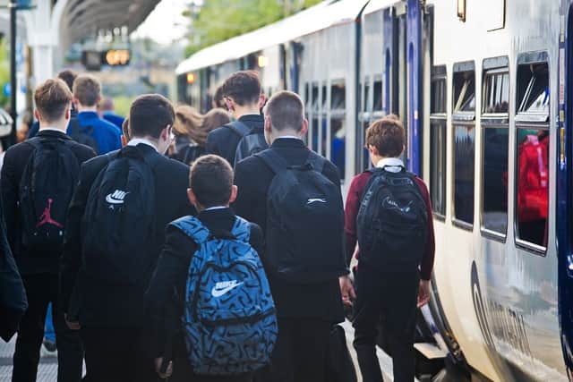 Schoolchildren leaving a Northern train