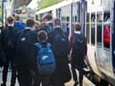 Schoolchildren leaving a Northern train