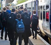 Schoolchildren leaving a Northern train