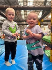 Elijah and Tommy ready to go down the slide