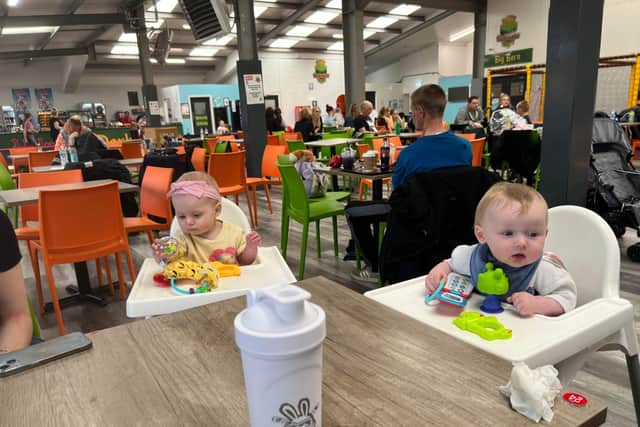 Layla and Grayson enjoying some play time in their highchairs