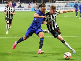 Alex Murphy #54 of Newcastle United challenges Diego Moreira #42 of Chelsea during the second half of the Premier League Summer Series match at Mercedes-Benz Stadium on July 26, 2023 in Atlanta, Georgia.