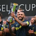 Newcastle United captain Jamaal Lascelles lifts the Sela Cup.