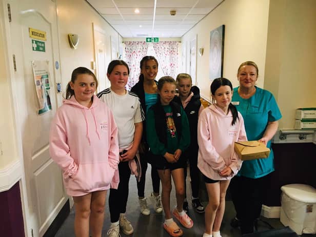 The group at the care home delivering the afternoon tea boxes
