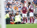 Tyrone Mings of Aston Villa looks dejected after sustaining an injury during the Premier League match between Newcastle United and Aston Villa at St. James Park on August 12, 2023 in Newcastle upon Tyne, England. (Photo by George Wood/Getty Images)