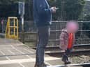 Shocking footage shows young children being played on the tracks 