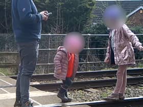 Shocking footage shows young children being played on the tracks 