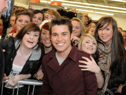 Look at the delight on the faces of these fans as they enjoy a very special moment. Photo: Stu Norton