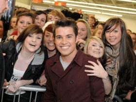 Look at the delight on the faces of these fans as they enjoy a very special moment. Photo: Stu Norton