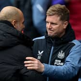 Pep Guardiola, Manager of Manchester City, and Eddie Howe, Manager of Newcastle United, interact prior to the Premier League match between Manchester City and Newcastle United at Etihad Stadium on March 04, 2023 in Manchester, England. (Photo by Michael Regan/Getty Images)