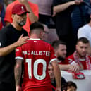 Alexis Mac Allister of Liverpool with Jurgen Klopp manager of Liverpool after being shown a red card during the Premier League match between Liverpool FC and AFC Bournemouth at Anfield on August 19, 2023 in Liverpool, England. (Photo by Andrew Powell/Liverpool FC via Getty Images)