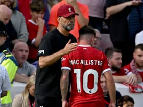 Alexis Mac Allister of Liverpool with Jurgen Klopp manager of Liverpool after being shown a red card during the Premier League match between Liverpool FC and AFC Bournemouth at Anfield on August 19, 2023 in Liverpool, England. (Photo by Andrew Powell/Liverpool FC via Getty Images)