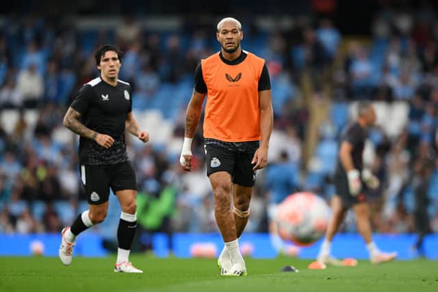 Joelinton warming up at Manchester City.