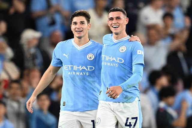 Manchester City duo Julian Alvarez (left) and Phil Foden (right). (Photo by Michael Regan/Getty Images)