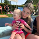 Layla and her cousin Lily paddling in the pool