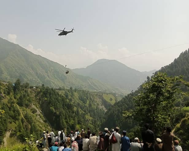 Eight people have been rescued after being trapped inside a cable car in Pakistan