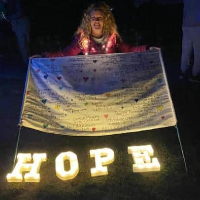 Angie with the banner at last year's event 