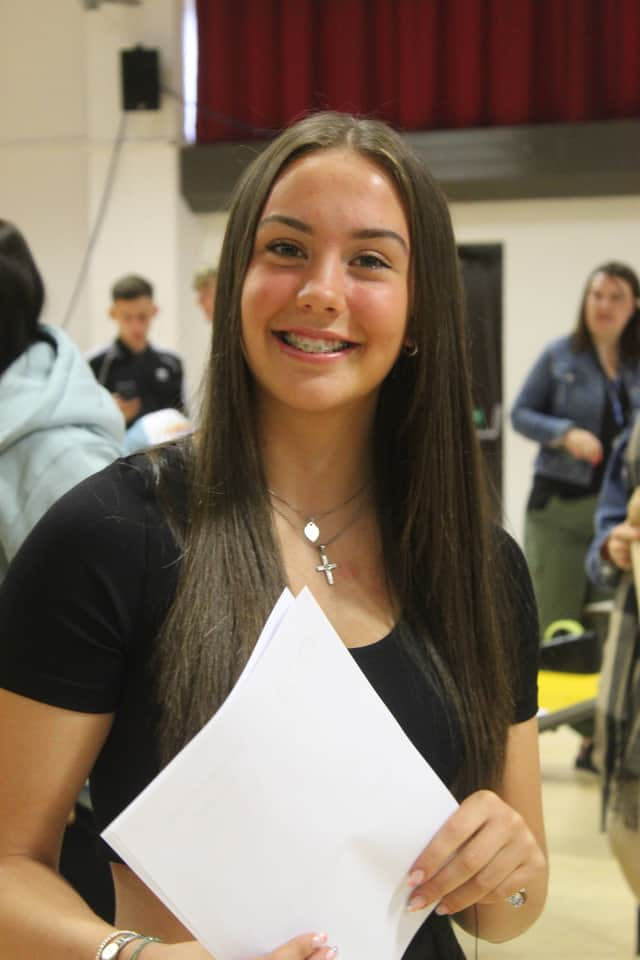 A happy pupil celebrating her results 