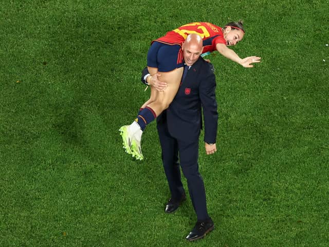 This picture taken on August 20, 2023 shows President of the Royal Spanish Football Federation Luis Rubiales carrying Spain's Athenea del Castillo Beivide on his shoulder as they celebrate winning the Australia and New Zealand 2023 Women's World Cup final football match between Spain and England at Stadium Australia in Sydney. 