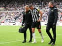 Sven Botman of Newcastle United leaves the field with medical staff due to an injury during the Premier League match between Newcastle United and Liverpool FC at St. James Park on August 27, 2023 in Newcastle upon Tyne, England. 