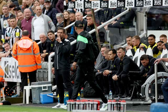 Jason Tindall gestures towards Jurgen Klopp during Newcastle United’s 2-1 defeat to Liverpool.  