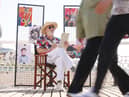 Jim Moir illustrates members of the public at the seaside