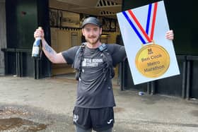 Ben Cook celebrating the completion of his 63 mile Metrothon challenge.