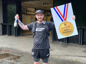 Ben Cook celebrating the completion of his 63 mile Metrothon challenge.