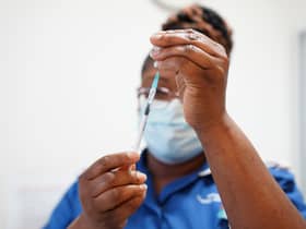A nurse prepares a dose of a Covid-19 vaccine.