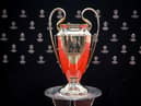 This photograph taken on August 31, 2023, shows the UEFA Champions League football trophy cup during the ceremony for the draw of the UEFA Champions League football tournament 2023-2024 at The Grimaldi Forum in the Principality of Monaco. (Photo by NICOLAS TUCAT / AFP) (Photo by NICOLAS TUCAT/AFP via Getty Images)