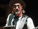 Jack Sonni was known as “the other guitarist” during the London band’s Brothers in Arms era. Source: https://commons.wikimedia.org/