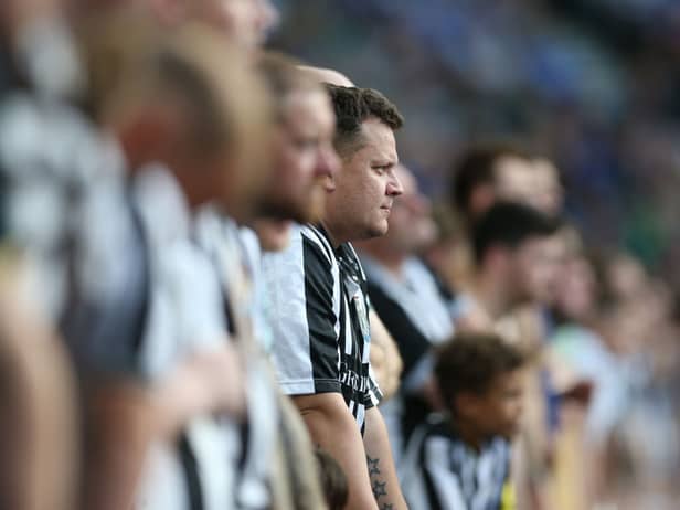 Newcastle United supporters watch the action during the Premier League match between Brighton & Hove Albion and Newcastle United at American Express Community Stadium on September 02, 2023 in Brighton, England. (Photo by Steve Bardens/Getty Images)