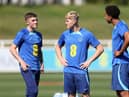 Alfie Devine, Lewis Hall and Bashir Humphreys look on during a training session at St Georges Park on September 05, 2023 in Burton-upon-Trent, England. (Photo by Catherine Ivill/Getty Images)