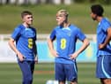 Alfie Devine, Lewis Hall and Bashir Humphreys look on during a training session at St Georges Park on September 05, 2023 in Burton-upon-Trent, England. (Photo by Catherine Ivill/Getty Images)