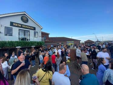 Crowds enjoying live entertainment.
Credit: New Sundial