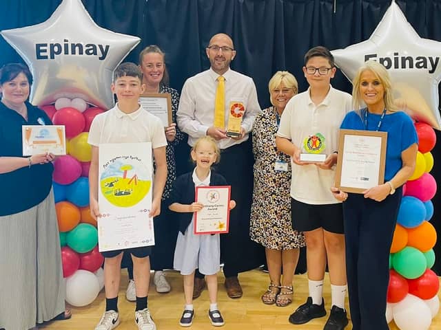 Epinay School headteacher Chris Rue (middle) with staff and pupils as they celebrate an ‘outstanding’ Ofsted inspection. Photo: Other 3rd Party.