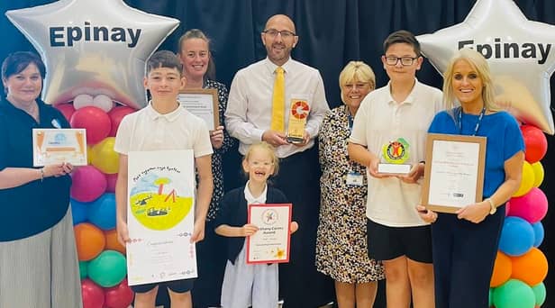 Epinay School headteacher Chris Rue (middle) with staff and pupils as they celebrate an ‘outstanding’ Ofsted inspection. Photo: Other 3rd Party.