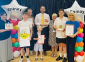 Epinay School headteacher Chris Rue (middle) with staff and pupils as they celebrate an ‘outstanding’ Ofsted inspection. Photo: Other 3rd Party.