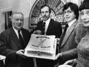 K Price, general manager of Binns, South Shields, cuts the cake to celebrate the firm's 50th anniversary in the town in 1977. Pictured left to right re: E Dennison, G Witten, assistant general manager; and Mrs R Cooper, boutique buyer. Photo: Shields Gazette