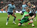 Brentford’s Dutch goalkeeper #01 Mark Flekken fouls Newcastle United’s English midfielder #10 Anthony Gordon to concede a penalty during the English Premier League football match between Newcastle United and Brentford at St James’ Park (Photo by PAUL ELLIS/AFP via Getty Images)