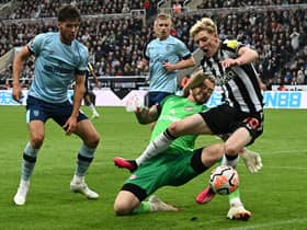 Brentford’s Dutch goalkeeper #01 Mark Flekken fouls Newcastle United’s English midfielder #10 Anthony Gordon to concede a penalty during the English Premier League football match between Newcastle United and Brentford at St James’ Park (Photo by PAUL ELLIS/AFP via Getty Images)
