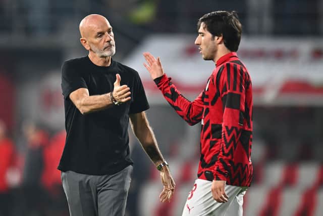 Stefano Pioli, Head Coach of AC Milan interacts with Sandro Tonali of AC Milan prior to the Serie A match between US Cremonese and AC Milan at Stadio Giovanni Zini on November 08, 2022 in Cremona, Italy.
