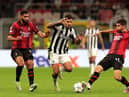  Bruno Guimaraes of Newcastle United challenges for the ball with Olivier Giroud and Christian Pulisic of AC Milan during the UEFA Champions League Group F match between AC Milan and Newcastle United FC at Stadio Giuseppe Meazza on September 19, 2023 in Milan, Italy. (Photo by Emilio Andreoli/Getty Images)