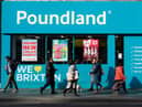 Shoppers walk past a Poundland shop in Brixton, south London.