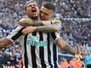 Newcastle player Bruno Guimaraes (l) celebrates with Kieran Trippier after the first Newcastle goal during the Premier League match between Newcastle United and Manchester United at St. James Park on April 02, 2023 in Newcastle upon Tyne, England. (Photo by Stu Forster/Getty Images)