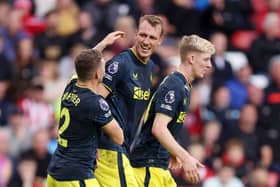 Dan Burn of Newcastle United celebrates with teammates after scoring the team’s second goal during the Premier League match between Sheffield United and Newcastle United at Bramall Lane on September 24, 2023 in Sheffield, England. (Photo by George Wood/Getty Images)