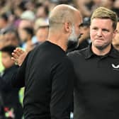 MANCHESTER, ENGLAND - AUGUST 19: Eddie Howe, Manager of Newcastle United, interacts with Pep Guardiola, Manager of Manchester City, prior to the Premier League match between Manchester City and Newcastle United at Etihad Stadium on August 19, 2023 in Manchester, England. (Photo by Michael Regan/Getty Images)